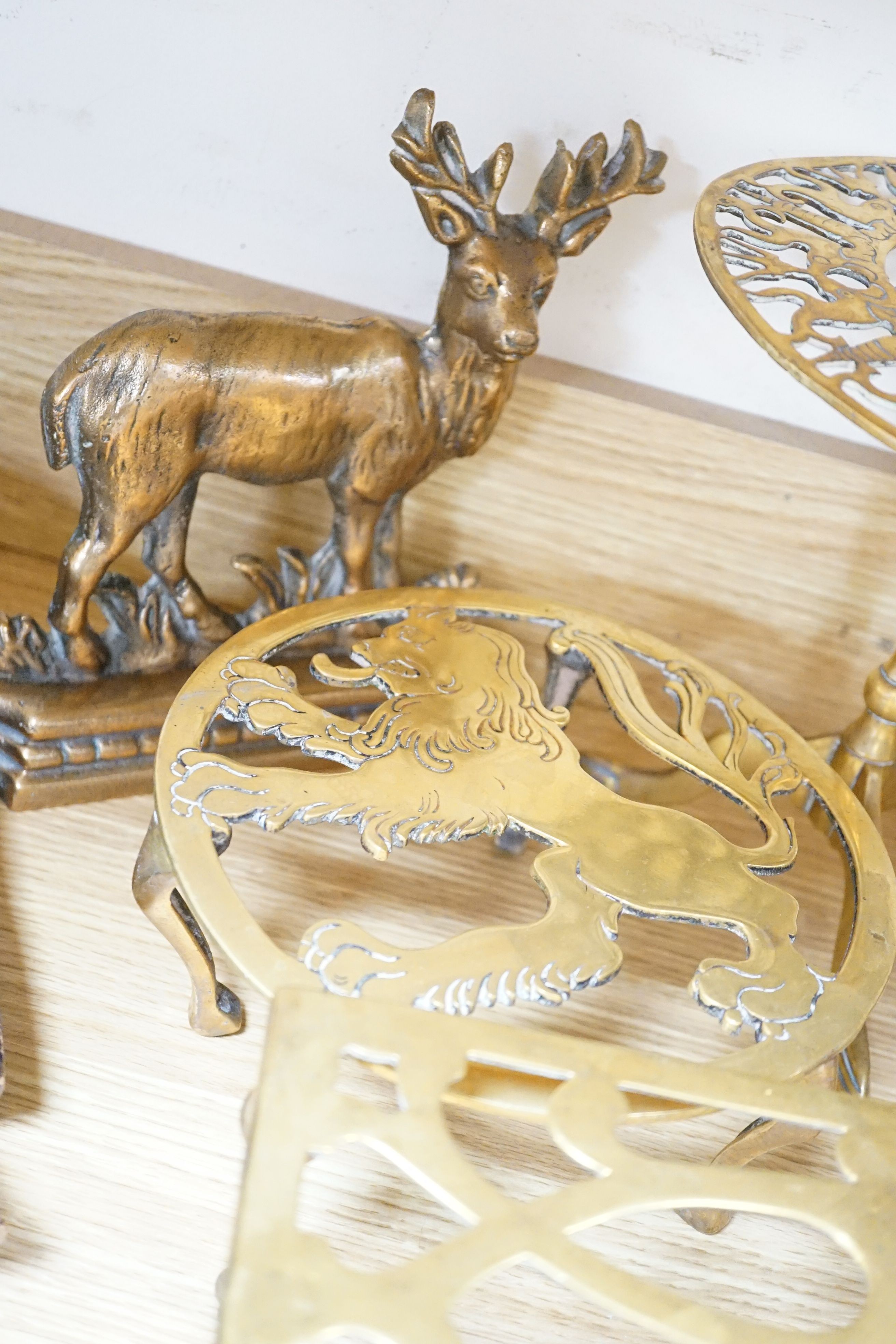 Assorted brass trivets and other brassware